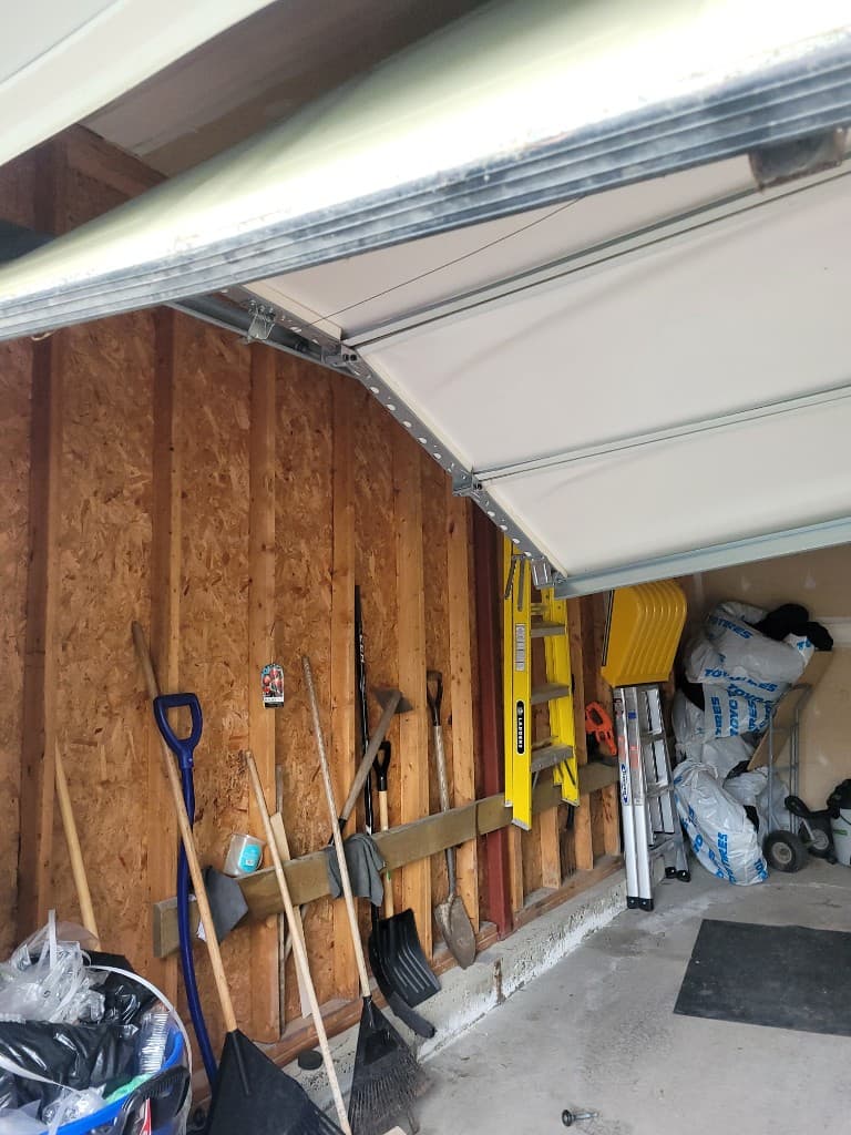 Off-track garage door emergency repair in Cumberland, East Ottawa